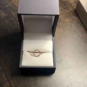 Gold plated with cubic zarconia accents.